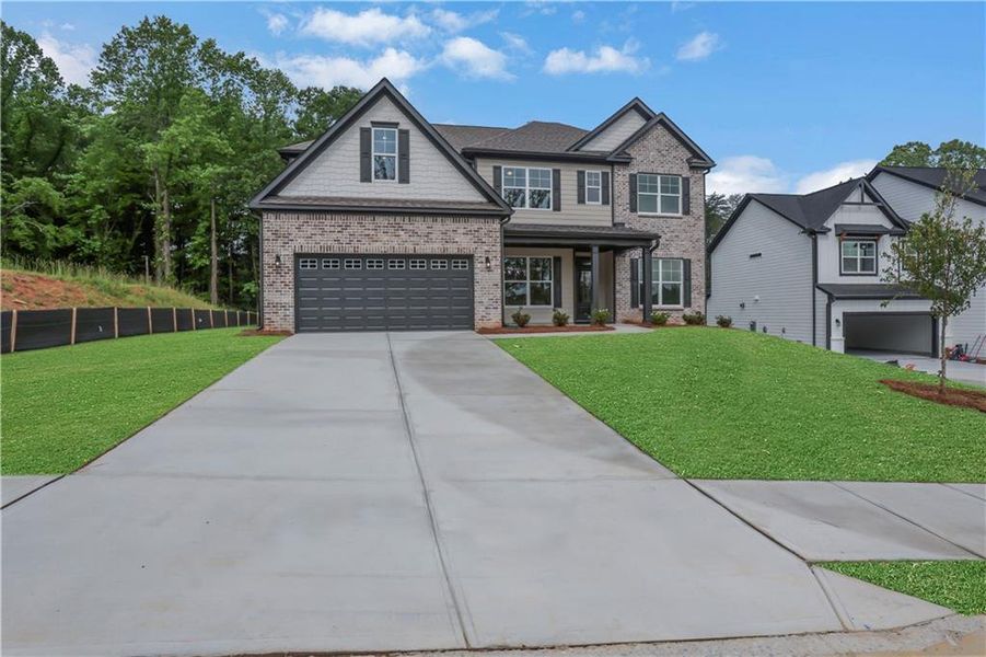 Front exterior of a new home in Arbor West, Dawsonville, GA, highlighting curb appeal (Image 27).