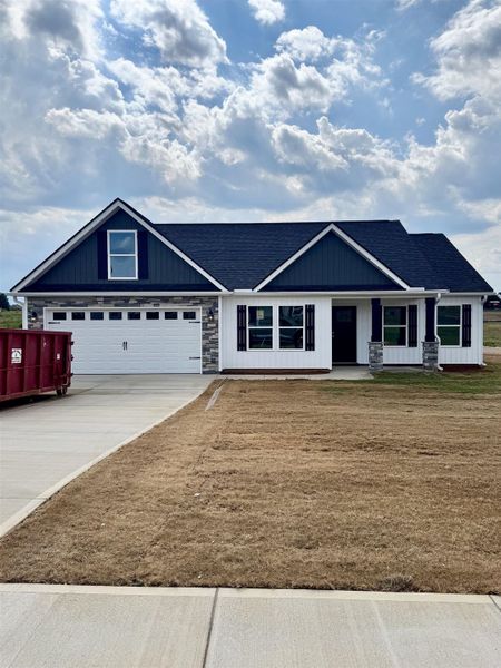 Front exterior of a new home in Bent Tree, Gaffney, SC, highlighting curb appeal (Image 1). Front exterior of a new home in Bent Tree, Gaffney, SC, highlighting curb appeal (Image 1).