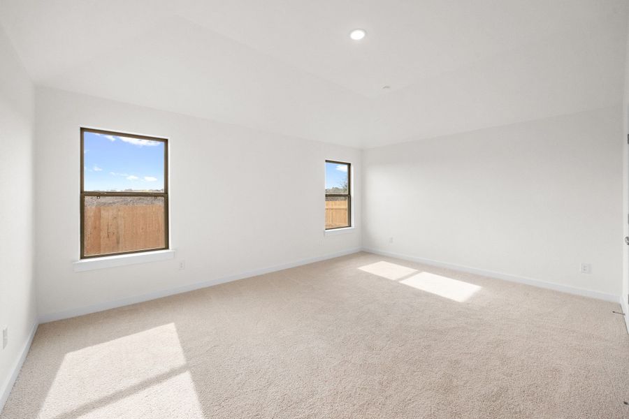 Primary Bedroom in the Turquoise home plan by Trophy Signature Homes – REPRESENTATIVE PHOTO