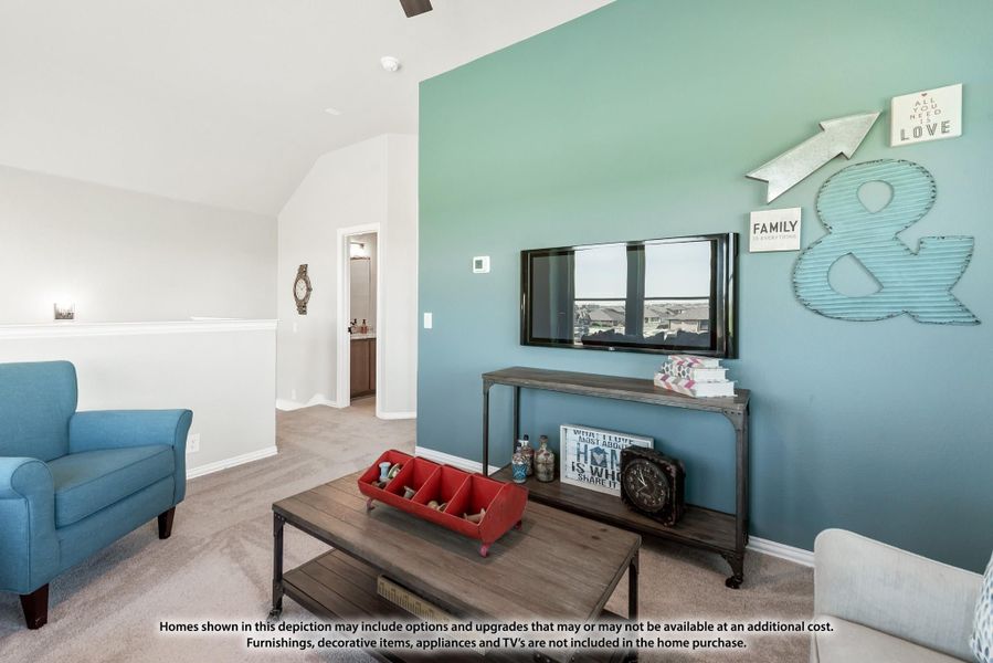 Living room with teal accent wall, wall-mounted TV, wood coffee table, and blue armchair on carpet Living room with teal accent wall, wall-mounted TV, wood coffee table, and blue armchair on carpet