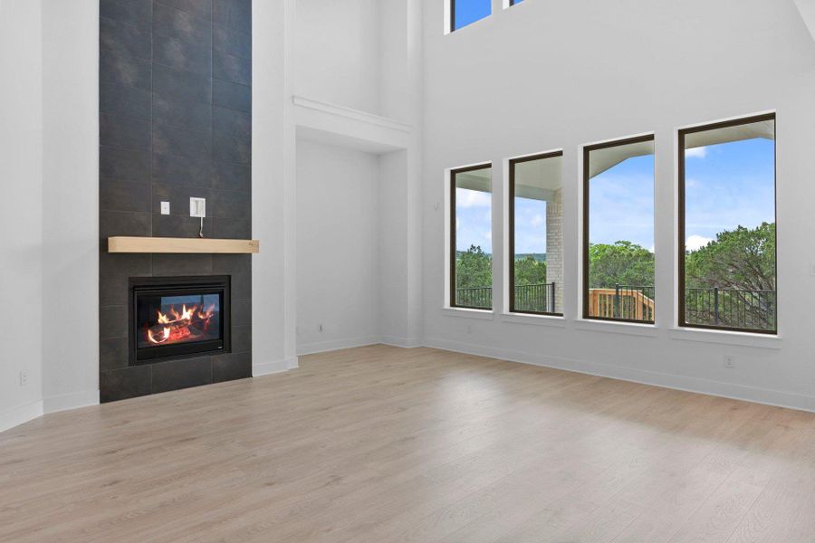 Family Room with soaring ceiling & fireplace