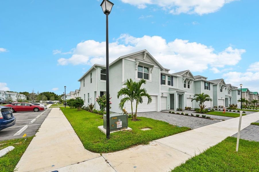 Front exterior of a new home in Tidewater, Fort Pierce, FL, highlighting curb appeal (Image 16). Front exterior of a new home in Tidewater, Fort Pierce, FL, highlighting curb appeal (Image 16).