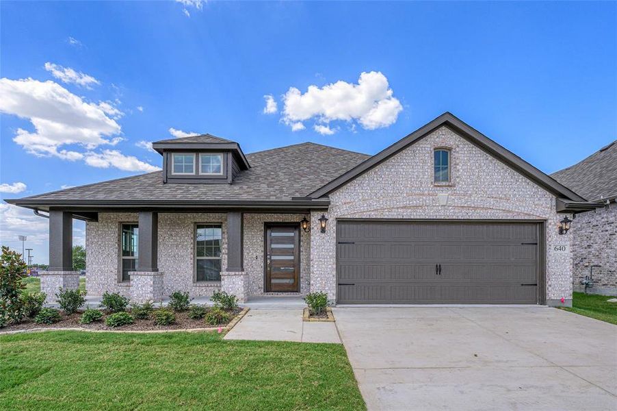 View of front of house featuring covered porch, a shingled roof, concrete driveway, a front lawn, and a garage View of front of house featuring covered porch, a shingled roof, concrete driveway, a front lawn, and a garage
