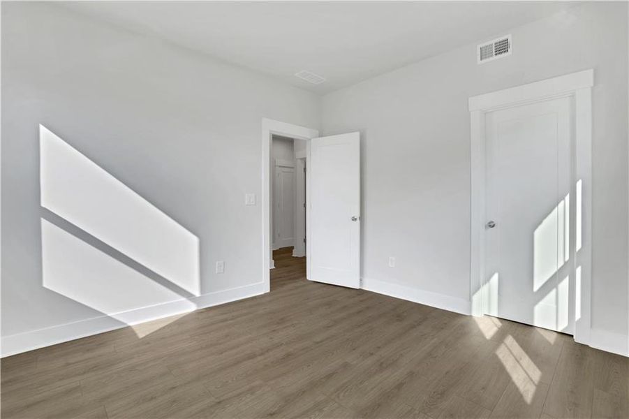Spacious, unfurnished interior of a new home in The Paddocks at Doc Hughes, Buford (Image 29).