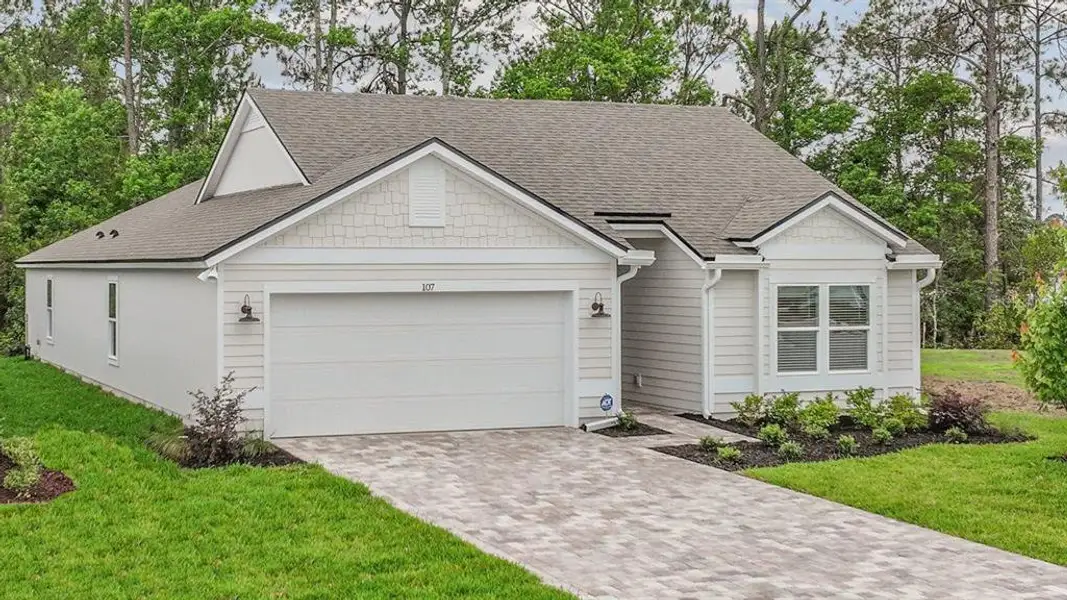 Front exterior of a new home in American Village, Palm Coast, FL, highlighting curb appeal (Image 2). Front exterior of a new home in American Village, Palm Coast, FL, highlighting curb appeal (Image 2).