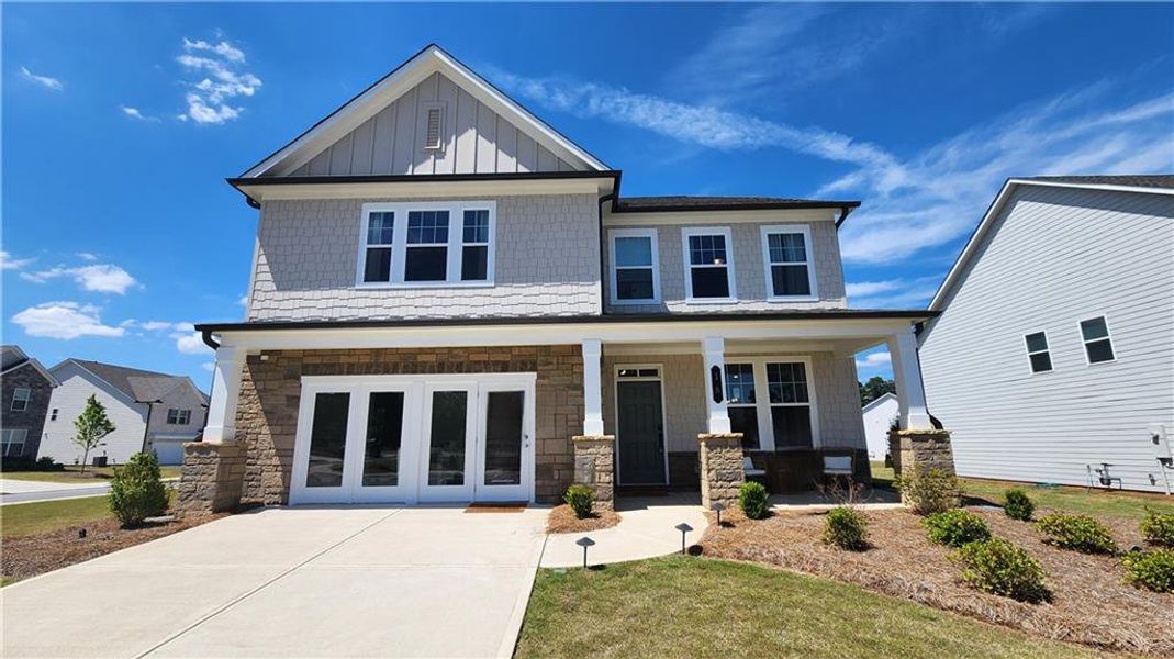 Front exterior of a new home in The Estates at Casteel, Bethlehem, GA, highlighting curb appeal (Image 22). Front exterior of a new home in The Estates at Casteel, Bethlehem, GA, highlighting curb appeal (Image 22).