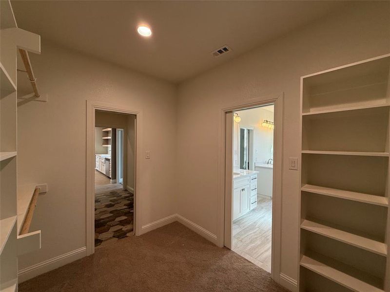 Laundry room connected to the master closet!