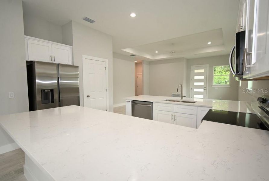 Furnished interior view inside a new home in , Dade City (Image 6).