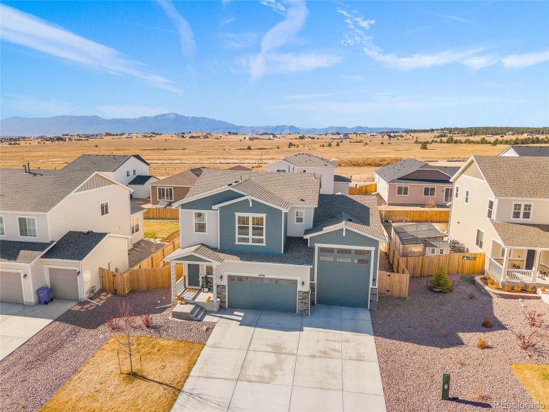 Front exterior of a new home in Paint Brush Hills, Peyton, CO, highlighting curb appeal (Image 29).