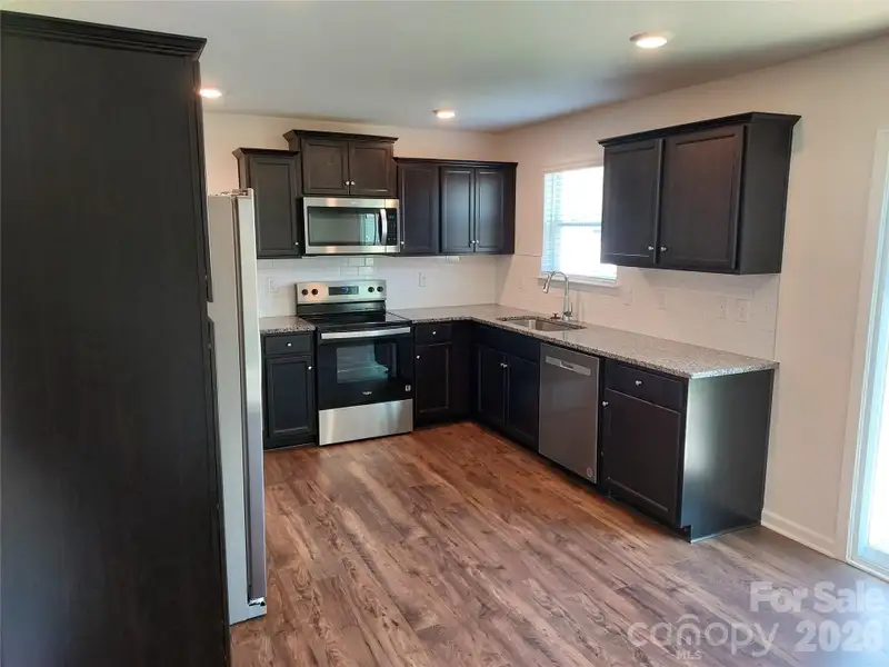 Furnished interior view inside a new home in , Waynesville (Image 4).