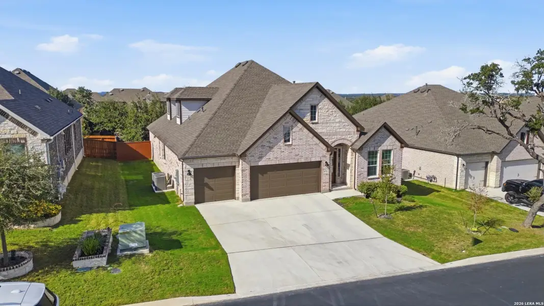 Front exterior of a new home in Front Gate at Fair Oaks Ranch 70, Fair Oaks Ranch, TX, highlighting curb appeal (Image 2). Front exterior of a new home in Front Gate at Fair Oaks Ranch 70, Fair Oaks Ranch, TX, highlighting curb appeal (Image 2).