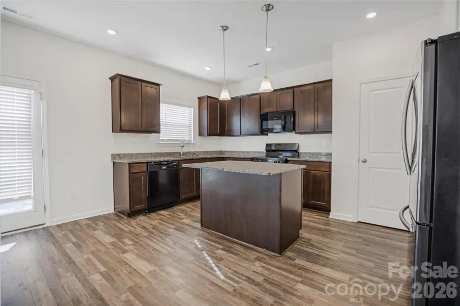 Furnished interior view inside a new home in Wilora Pond, Charlotte (Image 6).