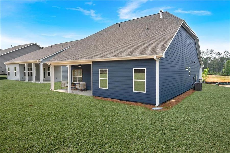 Exterior details and patio area of a home in Heritage Pointe at The Georgian, Villa Rica (Image 22).
