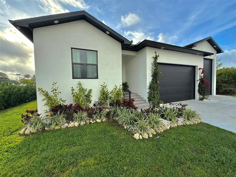 Front exterior of a new home in , Port Charlotte, FL, highlighting curb appeal (Image 27).
