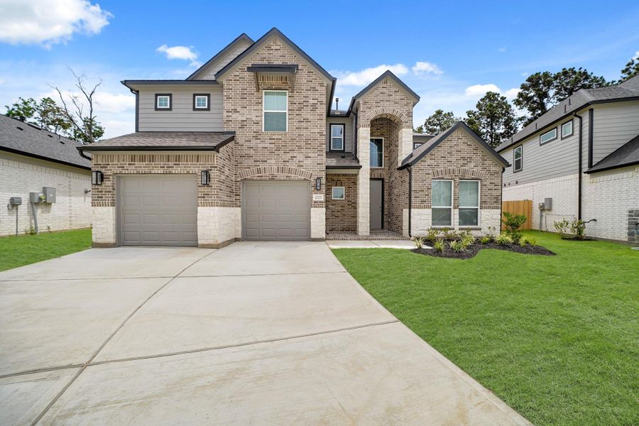 Front exterior of a new home in Barton Creek Ranch, Conroe, TX, highlighting curb appeal (Image 16). Front exterior of a new home in Barton Creek Ranch, Conroe, TX, highlighting curb appeal (Image 16).