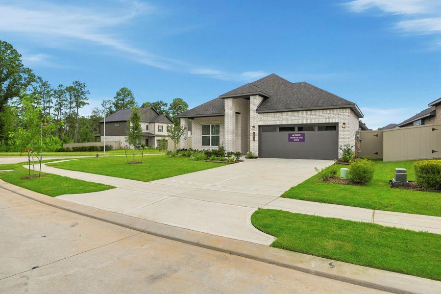 Front exterior of a new home in Audubon, Magnolia, TX, highlighting curb appeal (Image 2). Front exterior of a new home in Audubon, Magnolia, TX, highlighting curb appeal (Image 2).