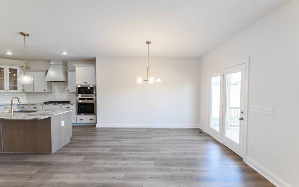 Furnished interior view inside a new home in Aden Woods, Fairview (Image 4).