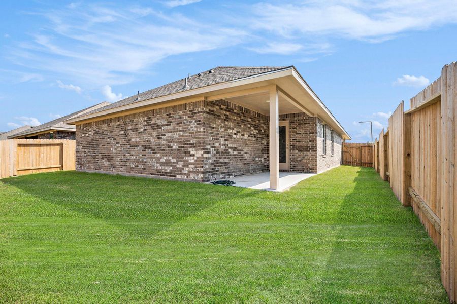 Front exterior of a new home in Kiber Reserve, Angleton, TX, highlighting curb appeal (Image 1).