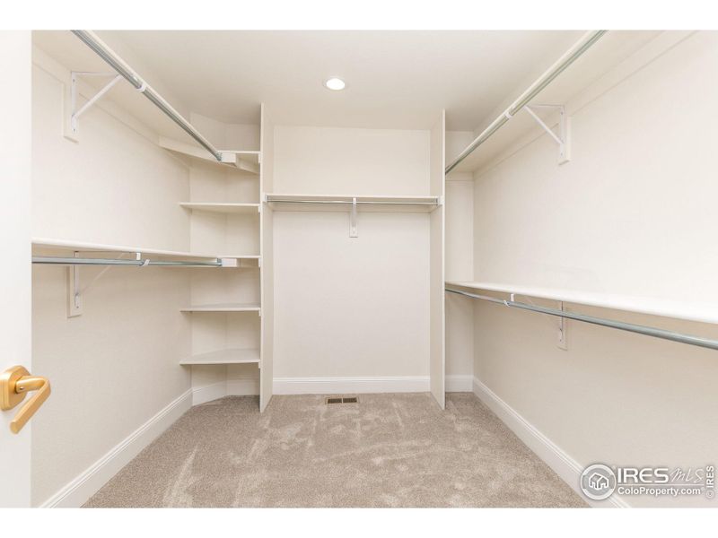 The large walk in clothes closet is at the back of the ensuite