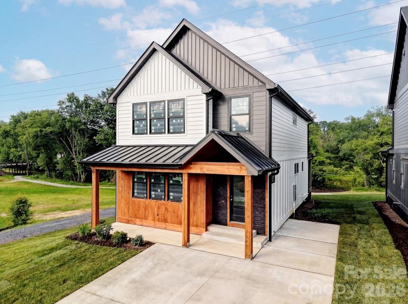 Front exterior of a new home in , Hendersonville, NC, highlighting curb appeal (Image 1). Front exterior of a new home in , Hendersonville, NC, highlighting curb appeal (Image 1).