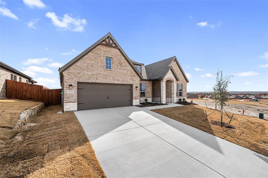 Front exterior of a new home in Waterford Park, Weatherford, TX, highlighting curb appeal (Image 25).