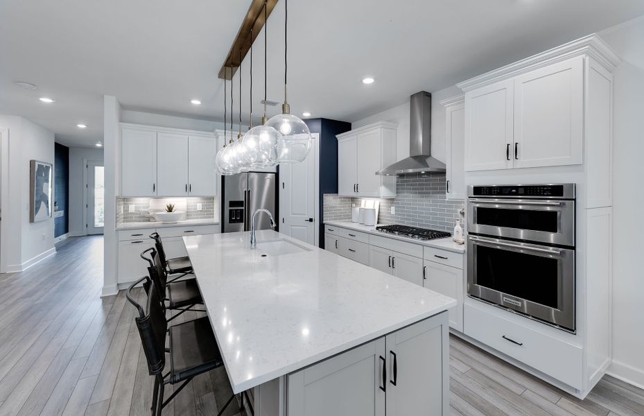 Representative furnished interior of a home built from the Whitestone by DiVosta in The Reserve at Eastpointe, Palm Beach Gardens (Image 9).