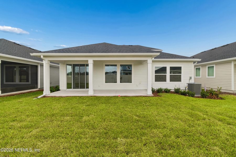Exterior details and patio area of a home in Tributary 50', Yulee (Image 3).