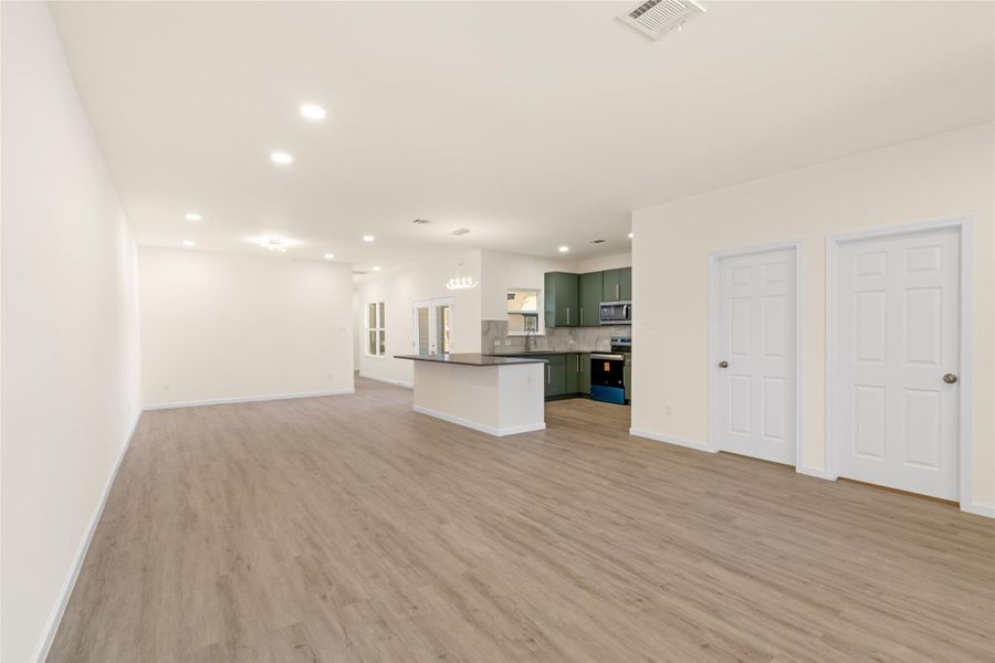 Flexible living space easily accommodates dining, lounging, and work-from-home needs.