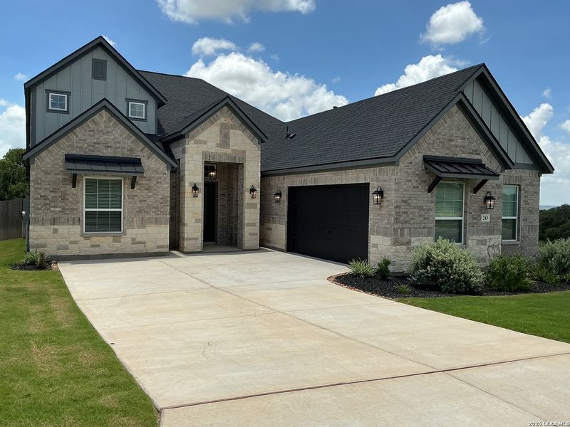 Front exterior of a new home in Potranco West, Castroville, TX, highlighting curb appeal (Image 2). Front exterior of a new home in Potranco West, Castroville, TX, highlighting curb appeal (Image 2).