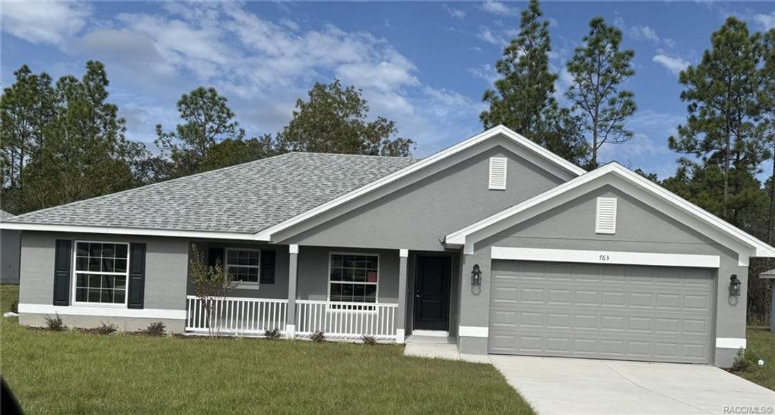 Front exterior of a new home in The Pines at Citrus Springs, Citrus Springs, FL, highlighting curb appeal (Image 1).