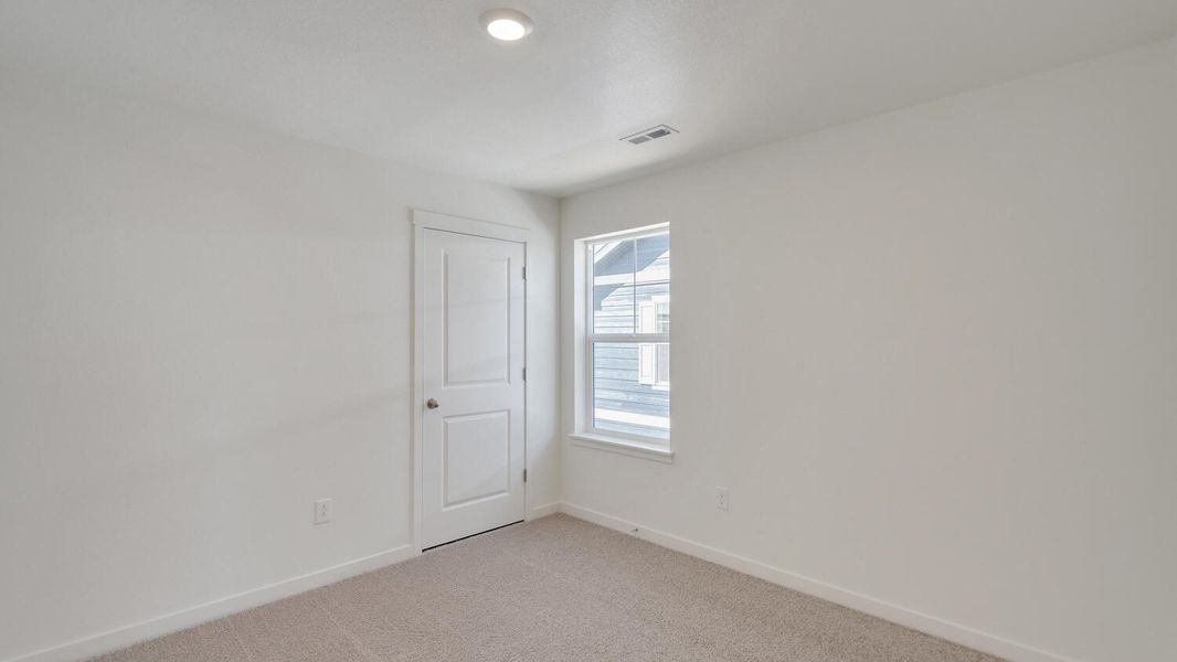 Spacious, unfurnished interior of a new home in The Ridge at Lorson Ranch, Colorado Springs (Image 14).
