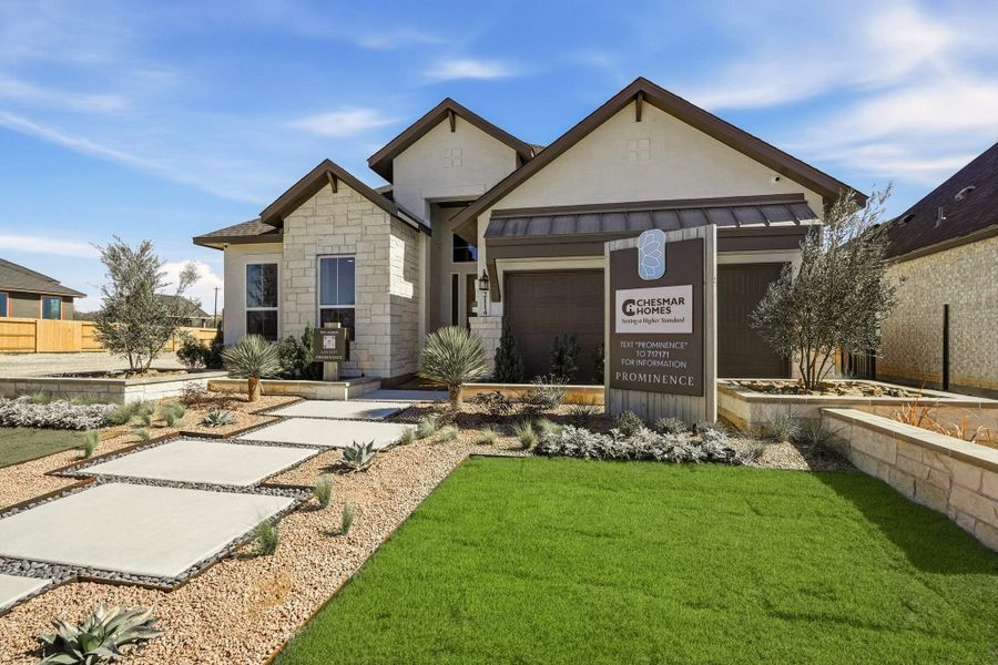 Front exterior of a new home in Prominence, San Antonio, TX, highlighting curb appeal (Image 29).