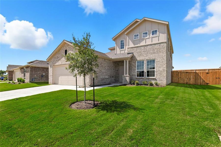 View of front of home featuring brick siding, concrete driveway, and a garage View of front of home featuring brick siding, concrete driveway, and a garage
