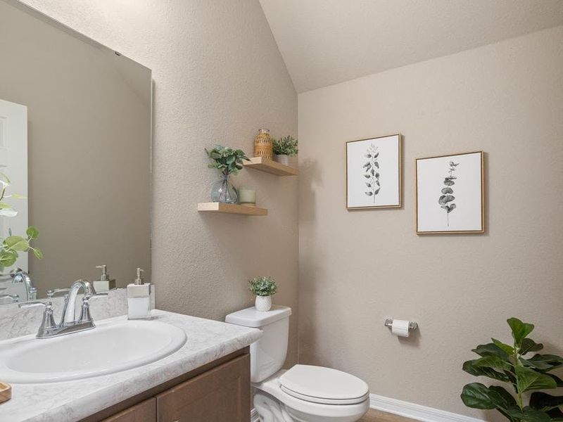 And, a downstairs powder room serves your guests - Mariposa townhome by Highland Homes And, a downstairs powder room serves your guests - Mariposa townhome by Highland Homes