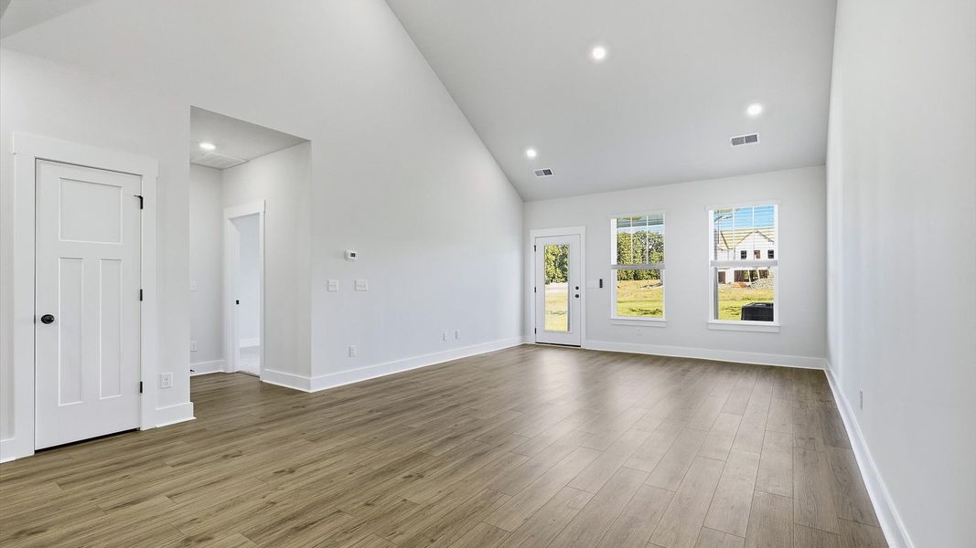 First-rate family room with eye-catching two-story ceilings and superior architectural detail