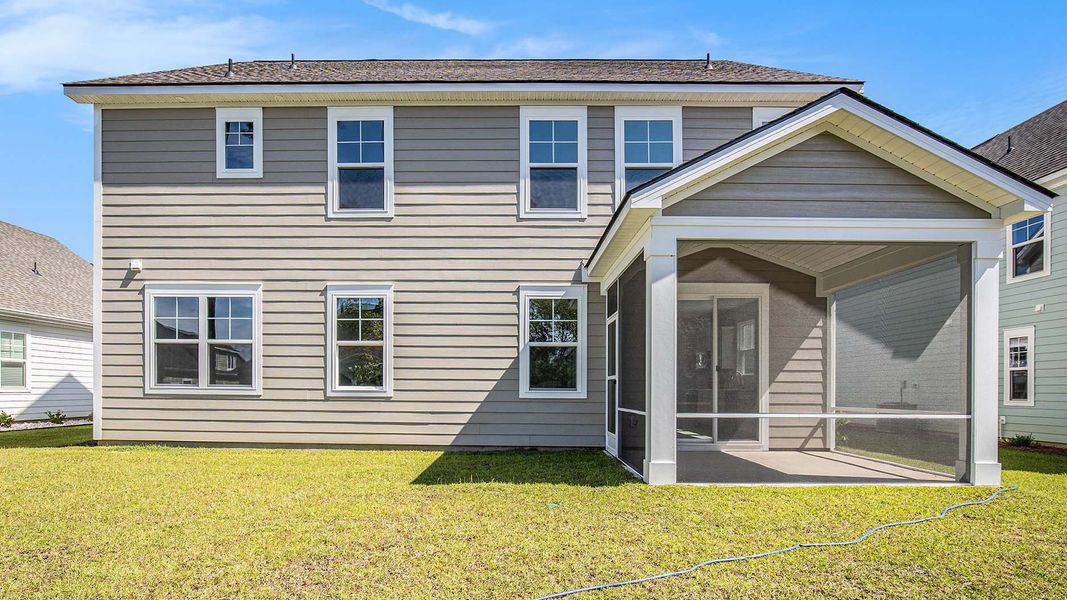 Exterior details and patio area of a home in Heron Pointe, Myrtle Beach (Image 3).