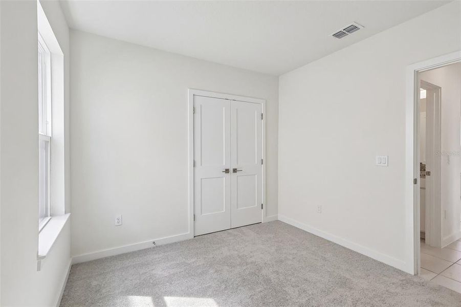 Spacious, unfurnished interior of a new home in Grasslands West, Lakeland (Image 24).