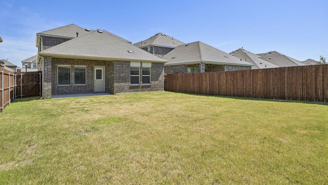 Exterior details and patio area of a home in Silverado, Aubrey (Image 3).