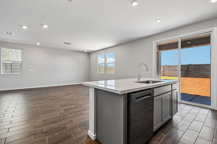 A kitchen with a large glass door. A kitchen with a large glass door.