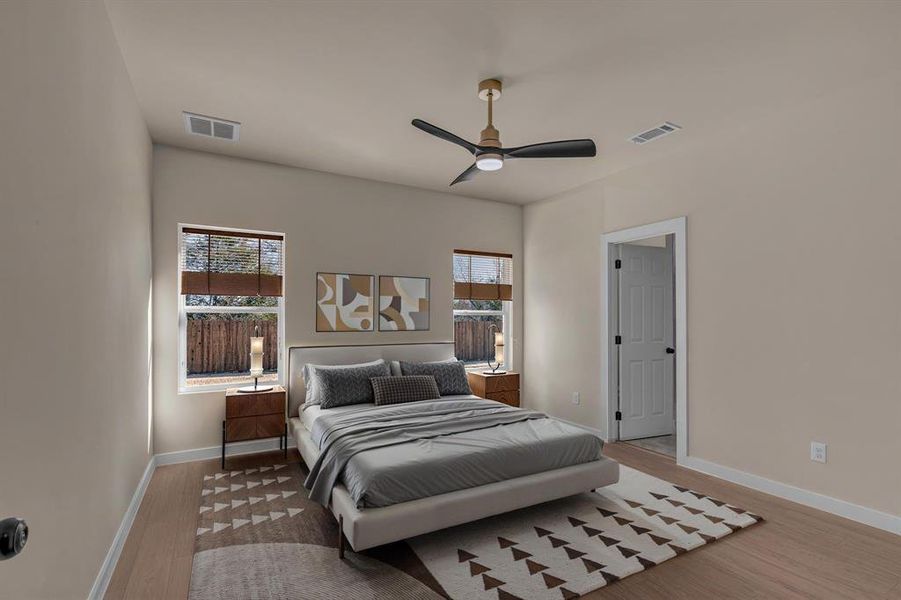 Bedroom featuring ceiling fan and light hardwood / wood-style floors