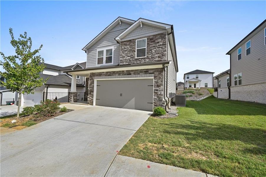 Front exterior of a new home in Sweetwater Green - Royal Series, Lawrenceville, GA, highlighting curb appeal (Image 24).