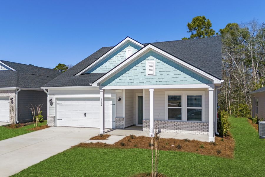 Front exterior of a new home in Waterside, Longs, SC, highlighting curb appeal (Image 2). Front exterior of a new home in Waterside, Longs, SC, highlighting curb appeal (Image 2).