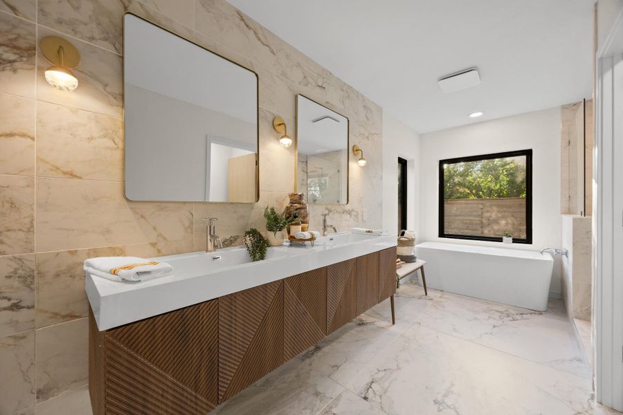 Primary bathroom with dual vanities and soaking tub Primary bathroom with dual vanities and soaking tub