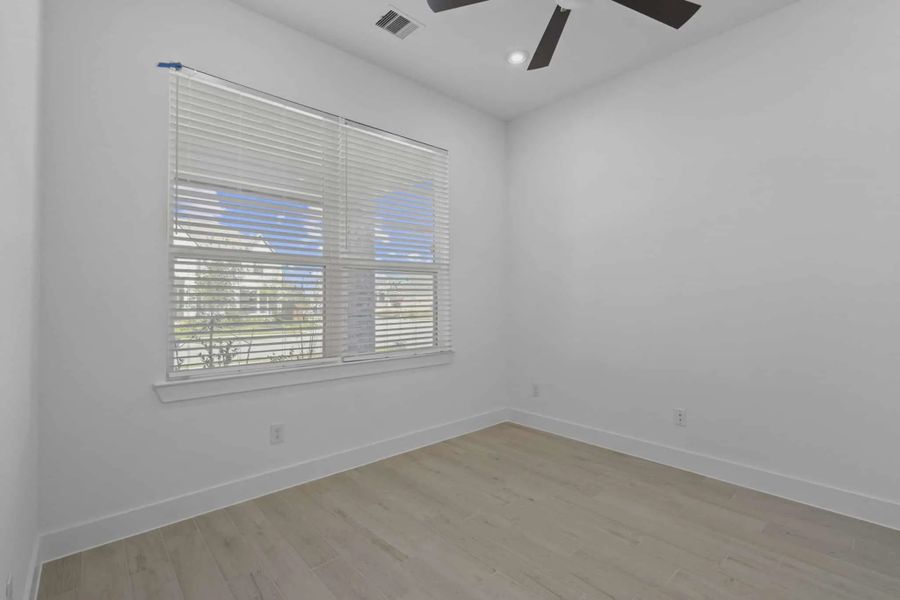 Representative unfurnished interior of a home built from the Waterford by Chesmar Homes in Meridiana 60's, Manvel (Image 34).