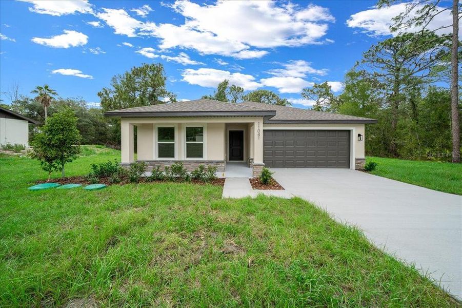 Front exterior of a new home in , Weeki Wachee, FL, highlighting curb appeal (Image 21).