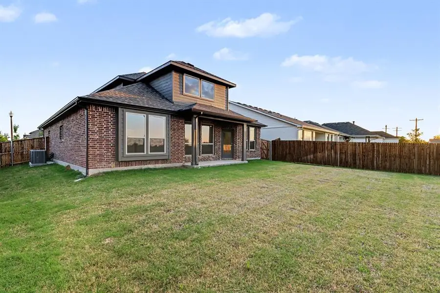 Exterior details and patio area of a home in Courts Of Bonnie Brae, Denton (Image 4).