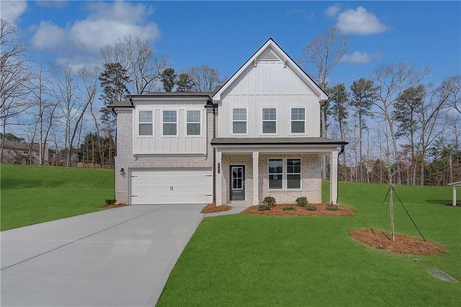 Front exterior of a new home in Hamilton Lakes, Lawrenceville, GA, highlighting curb appeal (Image 16).