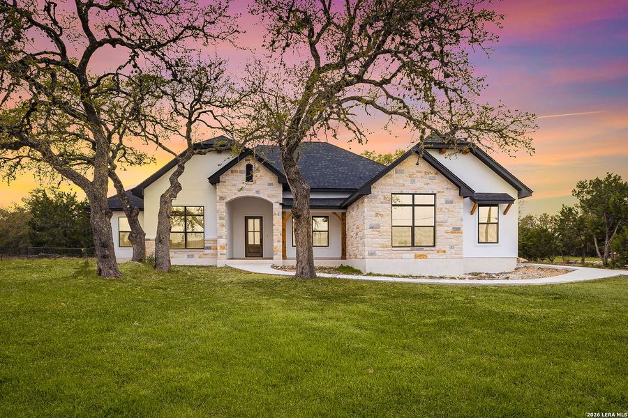 Front exterior of a new home in , Spring Branch, TX, highlighting curb appeal (Image 25). Front exterior of a new home in , Spring Branch, TX, highlighting curb appeal (Image 25).