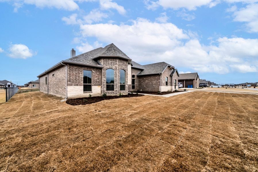 Representative exterior photo of a completed home built from the Jude by Robbie Hale Homes in High Meadows Estates, Nevada, TX (Image 2).