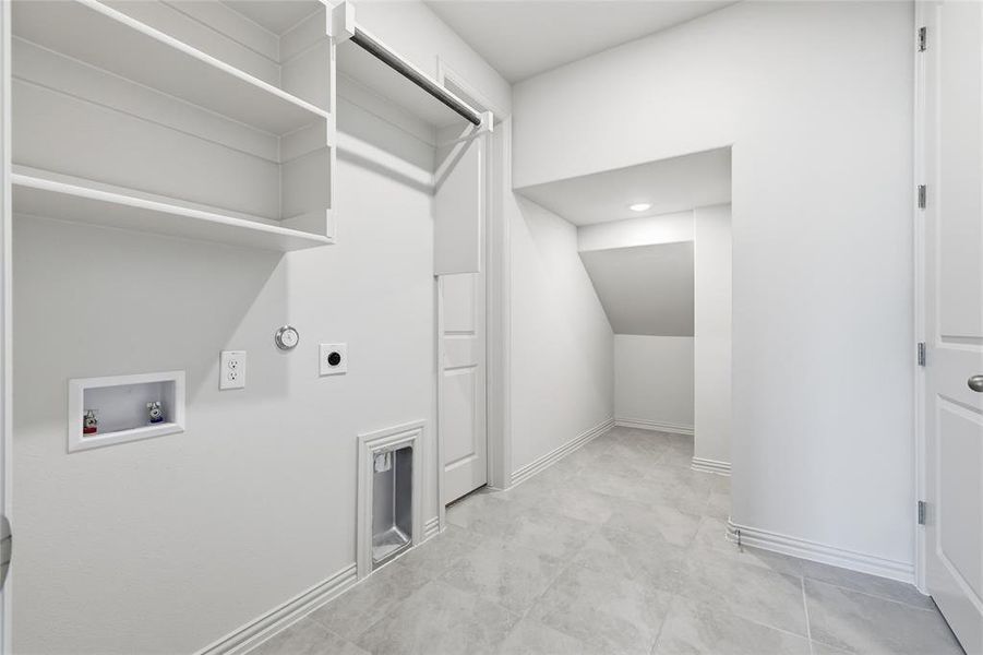 Laundry room with washer hookup, hookup for a gas dryer, and hookup for an electric dryer Laundry room with washer hookup, hookup for a gas dryer, and hookup for an electric dryer